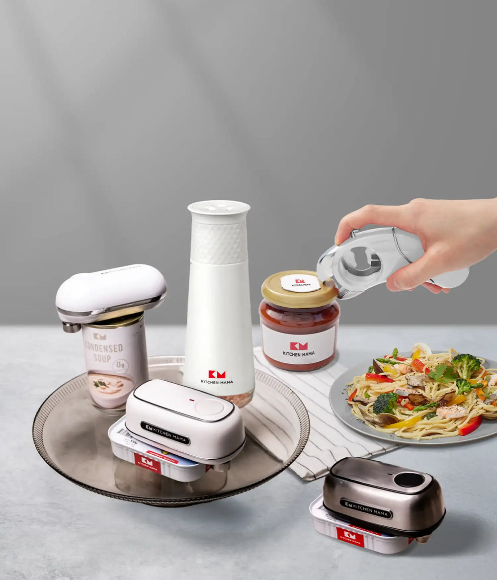 Kitchen Mama white and stainless steel kitchen tools, including can openers, grinder, and jar opener, displayed with food and canned goods.