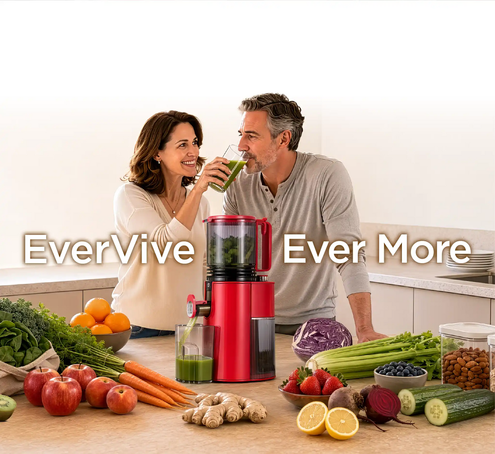 Kitchen Mama EverVive cold press juicer with a couple enjoying fresh green juice surrounded by fruits and vegetables.