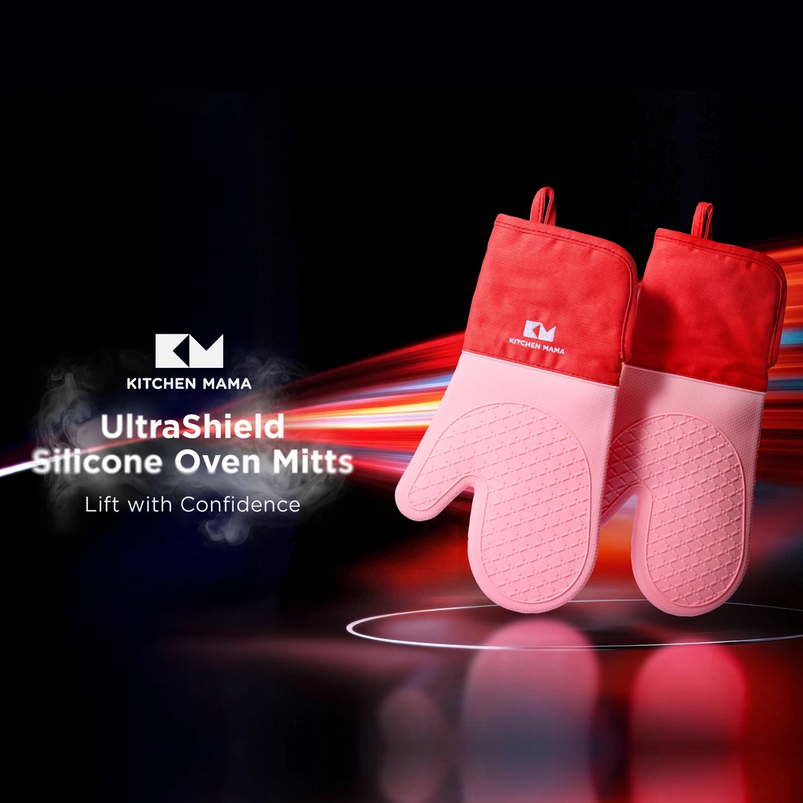 Two red and pink Kitchen Mama silicone oven mitts displayed on a dramatic black background with dynamic lighting effects. Text overlay reads: "Oven Mitts – Lift with Confidence" alongside the Kitchen Mama logo.
